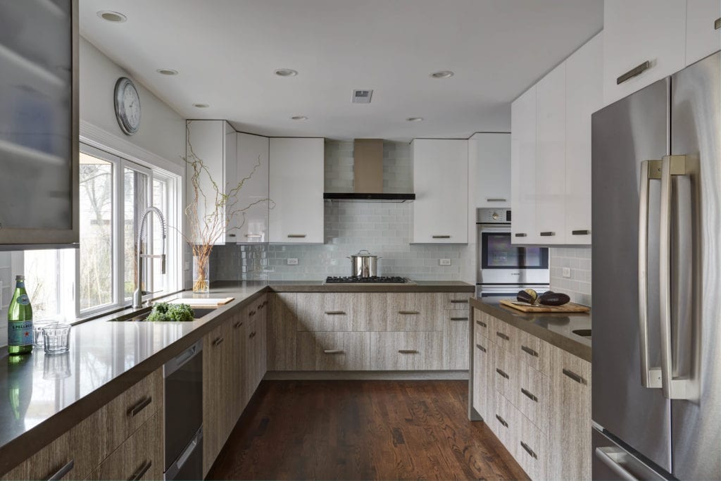 Kitchen remodel with white upper cabinets and gray lower cabinets