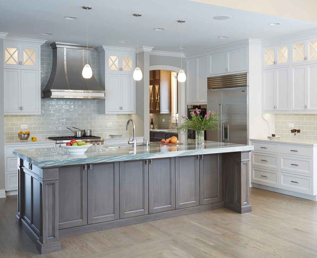 Kitchen remodel with gray cabinetry and white waterfall island