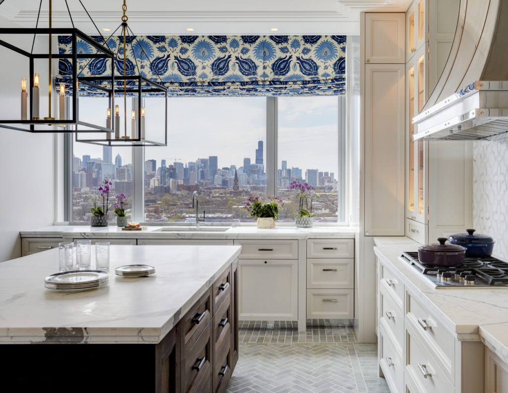 Kitchen remodel with white cabinetry and decorative window