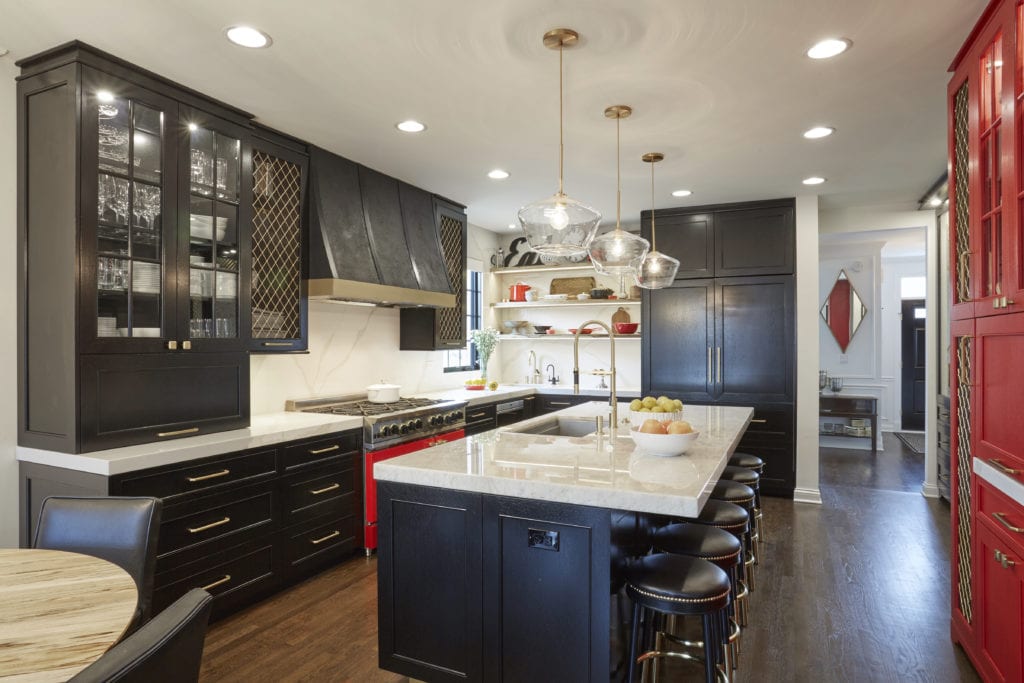 Kitchen remodel with dark cabinetry and glass-front doors