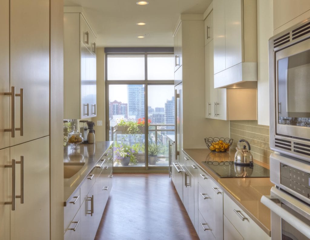 Kitchen remodel with white cabinetry and large island