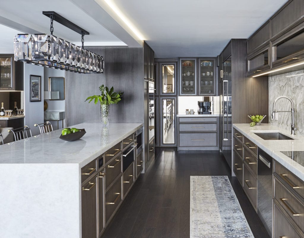 Kitchen remodel with dark cabinetry and light countertop