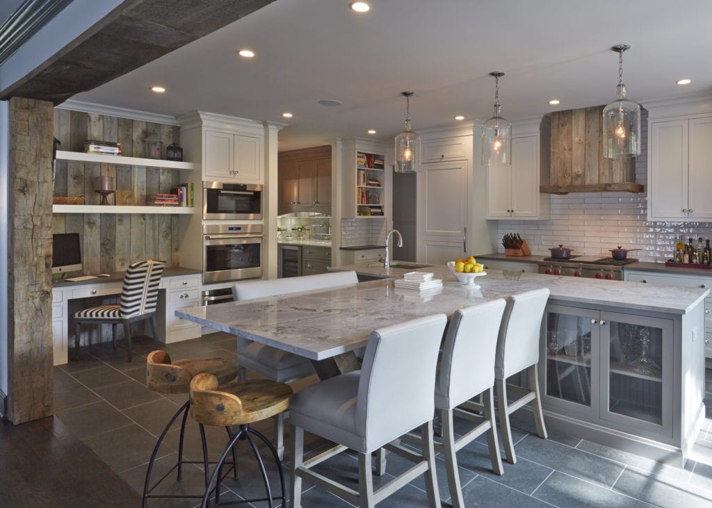 Kitchen remodel with dark island and pendant lighting