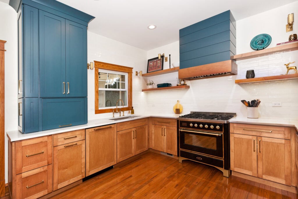 Kitchen remodel with blue upper cabinets and wood lower cabinets