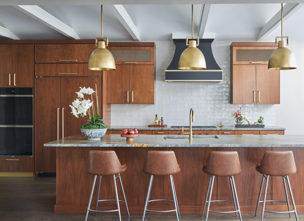 Kitchen remodel with warm wood cabinetry and pendant lighting over island