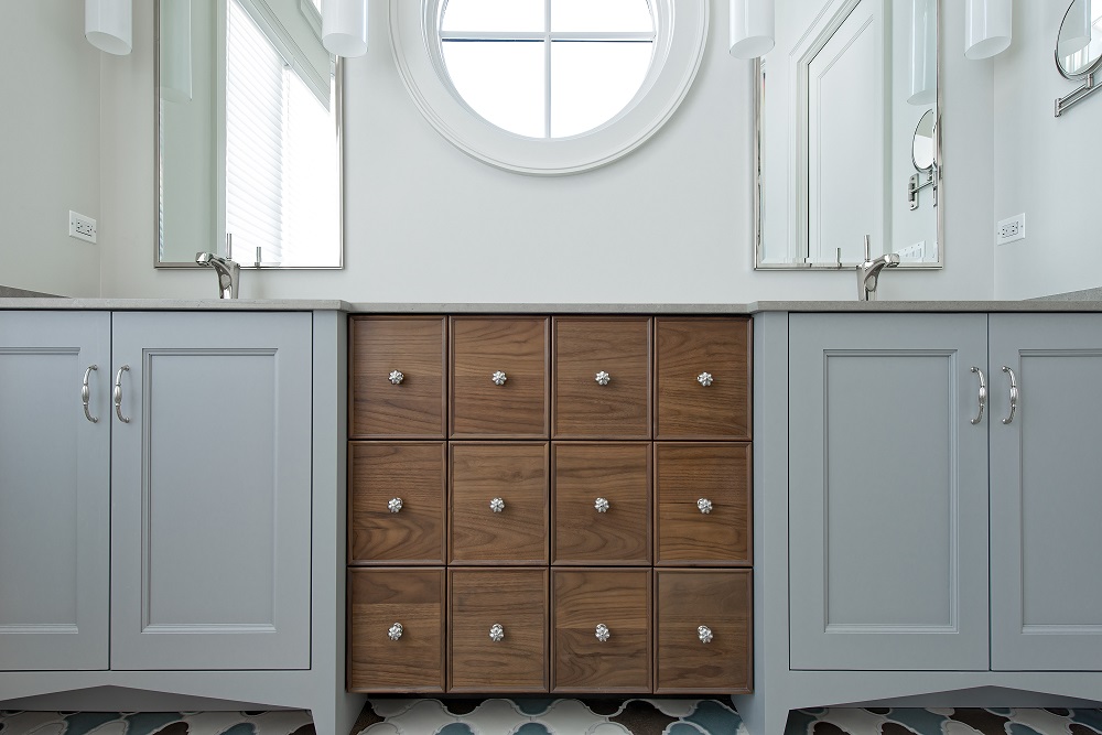 Custom Arbor Mills cabinetry with painted finish and wood drawer fronts