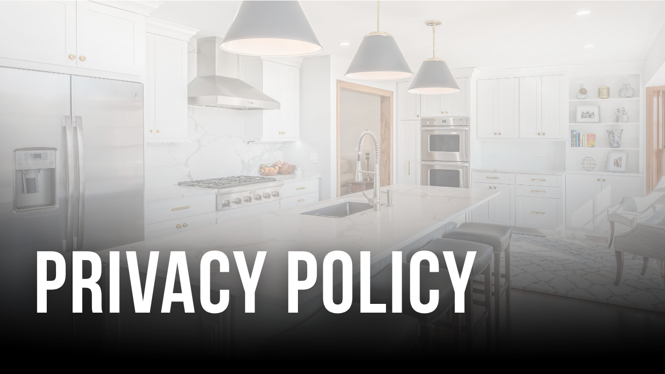 Modern white kitchen with pendant lighting, header image for DDK Kitchen Design Group's Privacy Policy page